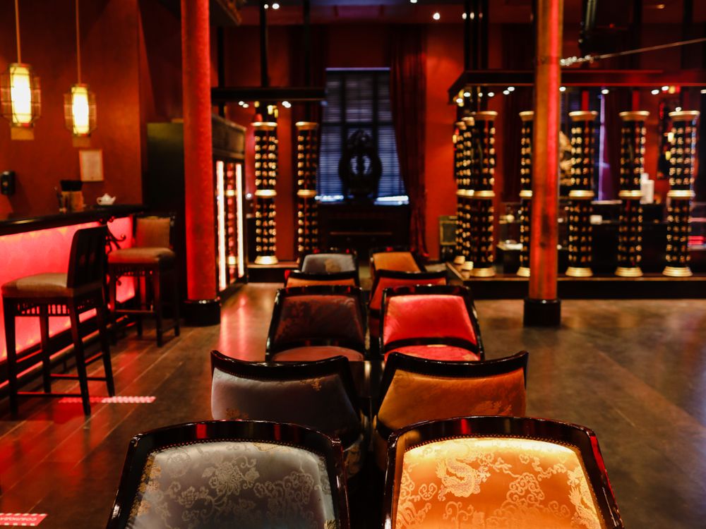 Renovated club bar with warm lighting and premium seating