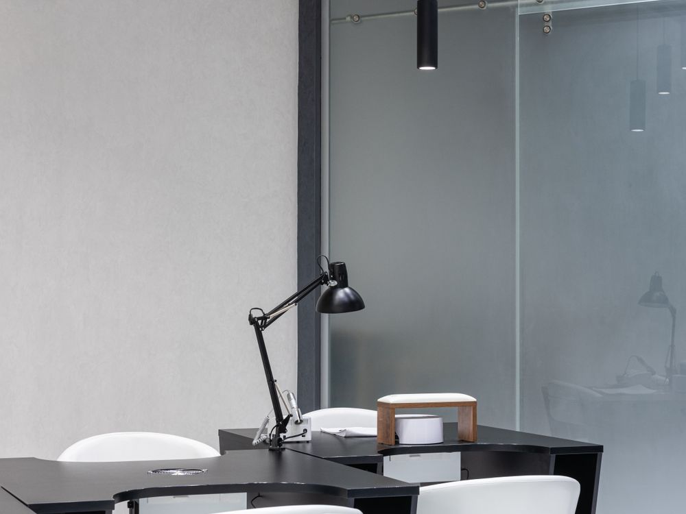 Renovated office interior with dark furniture